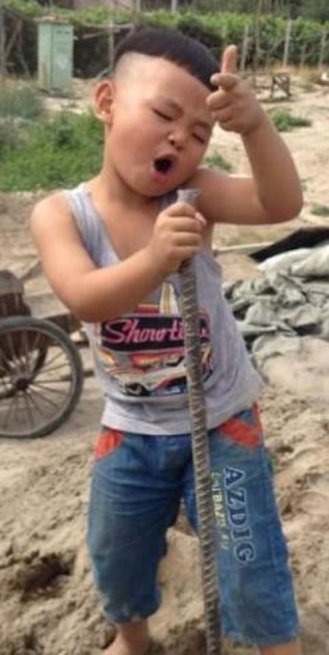 A kid in China using an iron pipe to show off his talent