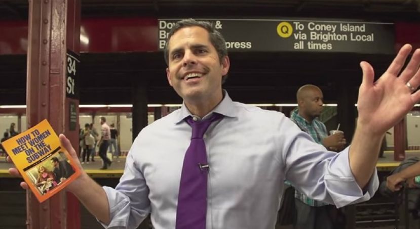 Brian Robinson, author of How to Meet Women in the Subway, with his new book on the Q Train platform at 34th Street in New York City