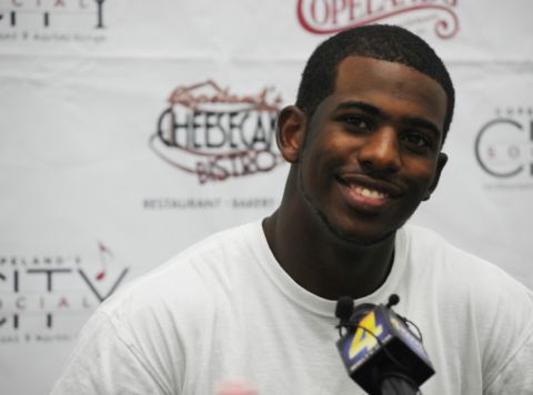 Paul answers questions at a youth basketball camp in July 2009