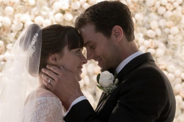 Dakota Johnson (left) and Jamie Dornan in marriage scene in Fifty Shades Freed